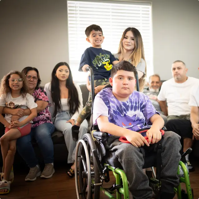 picture of JJ, Andrew, and their family